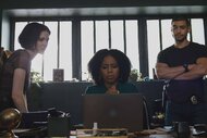 Det. Jet Slootmaekers, Sgt. Ayanna Bell, and Det. Bobby Reyes look at a laptop behind a desk in Law & Order: Organized Crime 401.