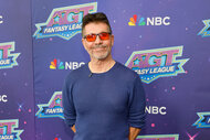 Simon Cowell poses on the red carpet of America’s Got Talent: Fantasy League