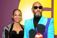 Alicia Keys and Swizz Beatz pose for a photo at "Giants: Art from the Dean Collection of Swizz Beatz and Alicia Keys"