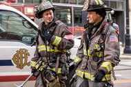 Kelly Severide (Taylor Kinney) and Matthew Casey (Jesse Spencer) in their firefighting uniforms