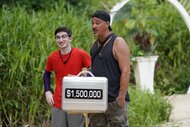 Aron Barbell and Rob Mariano stand next to a $1.5 million suitcase in Deal or No Deal Island Episode 102.
