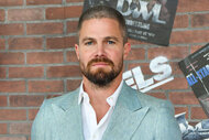 Stephen Amell wears a light grey suit for the premiere of "Heels"