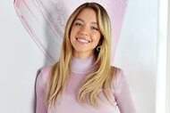 Sydney Sweeney smiles in a pink sweater at Ramscale Studio