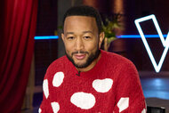 John Legend wears a red and white sweater on the voice episode 2508