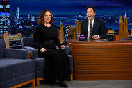 Maya Rudolph and Jimmy Fallon smile at the audience
