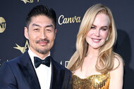 Brian Tee and Nicole Kidman pose on the red carpet together honoring nicole kidman