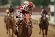Jockey Sonny Leon rides Rich Strike as they win the 148th running of the Kentucky Derby