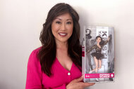 Kristi Yamaguchi holds up her Barbie