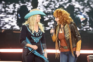 Miranda Lambert and Reba Mcentire on stage performing together at stagecoach