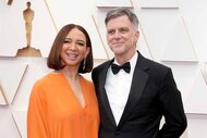 Maya Rudolph and Paul Thomas Anderson smiles together at the 94th Academy Awards.