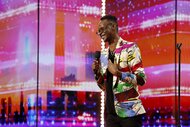 Learnmore Jonasi on stage during AGT Episode 1901.