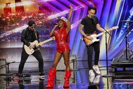 Reyna Roberts on stage with guitarists during AGT Episode 1901.