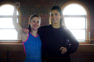 Aly Raisman and an athlete pose together