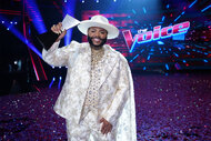 Asher HaVon on stage with the voice trophy during the live finale part 2