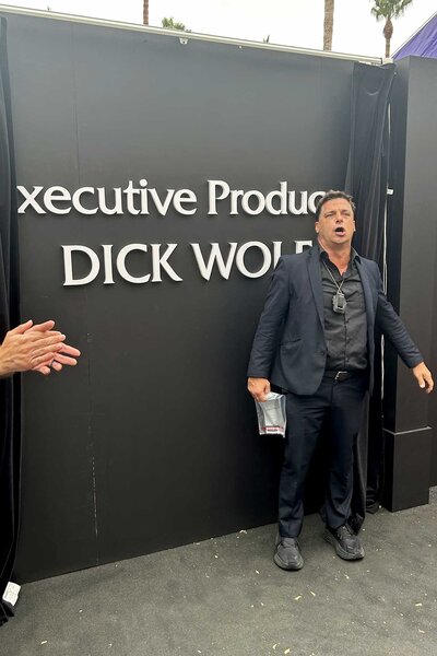 A sign reading Executive Producer Dick Wolf at San Diego Comic-Con 2023