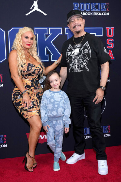 L-R) Coco Austin, Chanel Nicole Marrow, and Ice T pose on a red carpet for new york fashion week