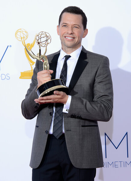 Jon Cryer holds an Emmy trophy at the 64th Annual Primetime Emmy Awards.