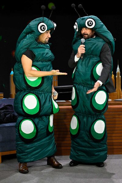 Lin Manuel-Miranda and jimmy fallon sing in caterpillar costumes on the tonight show