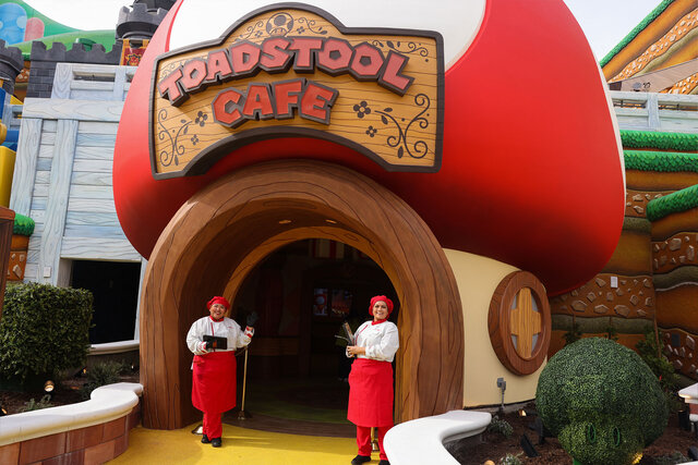Greeters await people for lunch at the Toadstool Cafe at Super Nintendo World