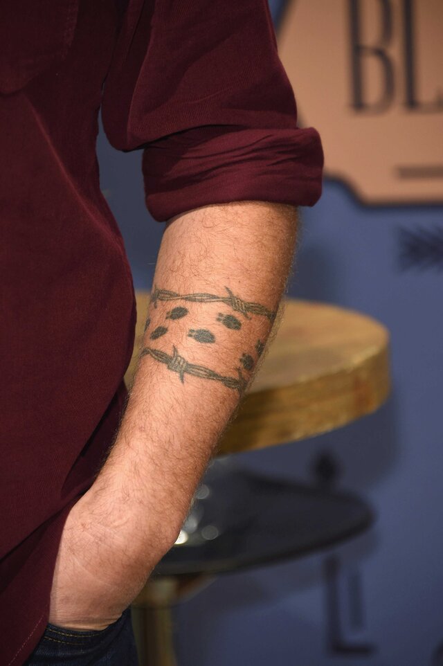 Up close photo of Blake Shelton's deer track tattoo.