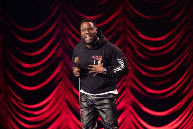 Kevin Hart performing on stage.