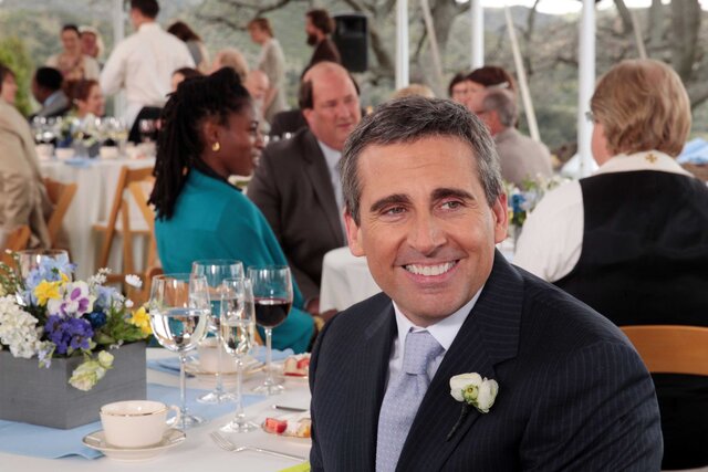 Michael Scott smiling in a scene from The Office.