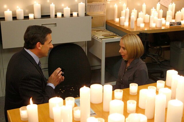 Michael proposing to Holly during a scene in The Office.