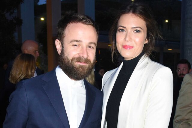 Taylor Goldsmith and Mandy Moore posing together.