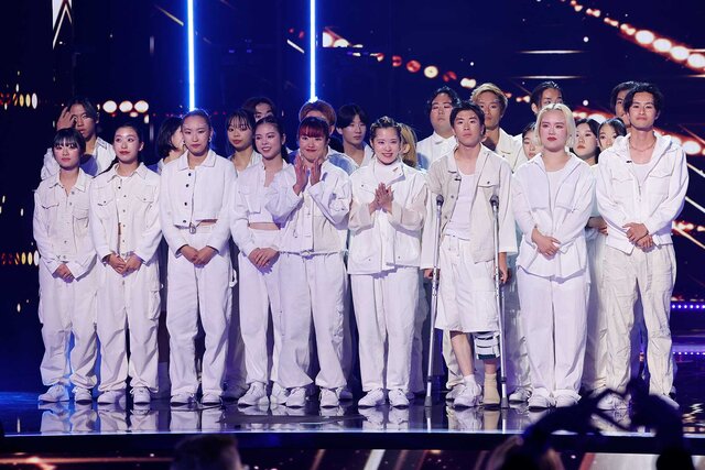 Chibi Unity appears wearing all white on stage during America's Got Talent.