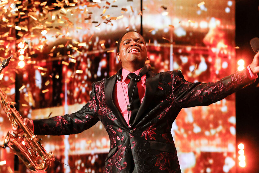 Avery Dixon receiving the Golden Buzzer on the AGT stage
