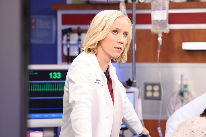 Hannah Asher (Jessy Schram) stands near a patient bed in Chicago Med episode 804.