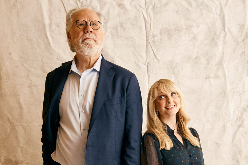 Melissa Rauch and John Larroquette posing during a phtooshoot