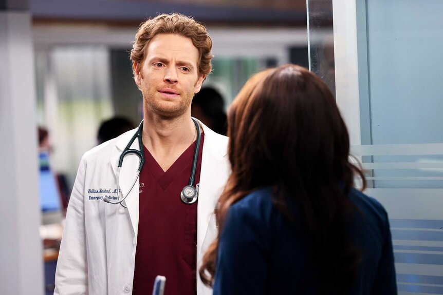 Chicago Med's Dr. Will Halstead looking at another character.