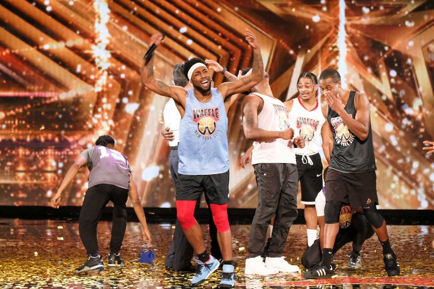 W.A.F.F.L.E Dance Crew surrounded by gold confetti on America's Got Talent.