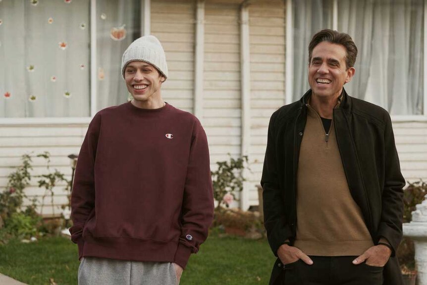 Pete Davidson (Pete Davidson) and Uncle Tommy (Bobby Cannavale) appear in a scene from Bupkis.