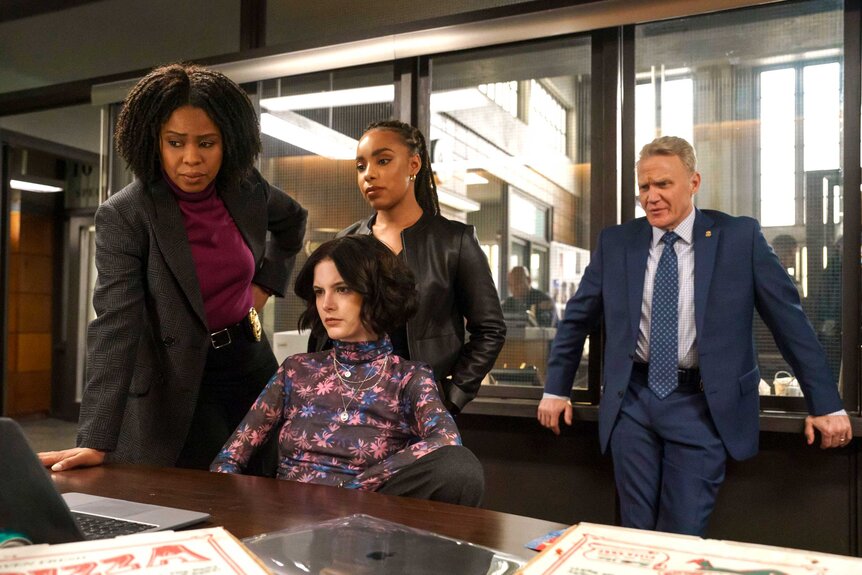 Sergeant Ayanna Bell (Danielle Moné Truitt), Detective Jet Slootmaekers (Ainsley Seiger), Officer Tonie Churlish (Jasmine Batchelor), and Chief McGrath (Terry Serpico) in a scene from Law & Order: Organized Crime.