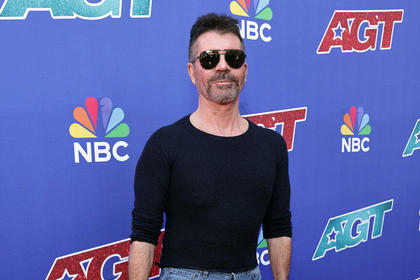 Simon Cowell attends an America's Got Talent red carpet.