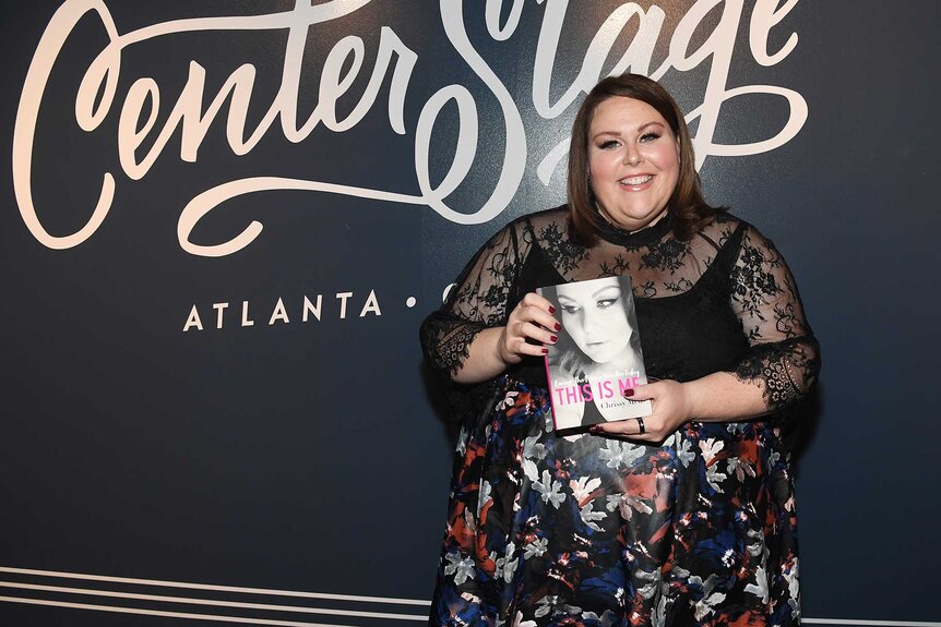 Chrissy Metz holding her book during the This Is Me book tour.