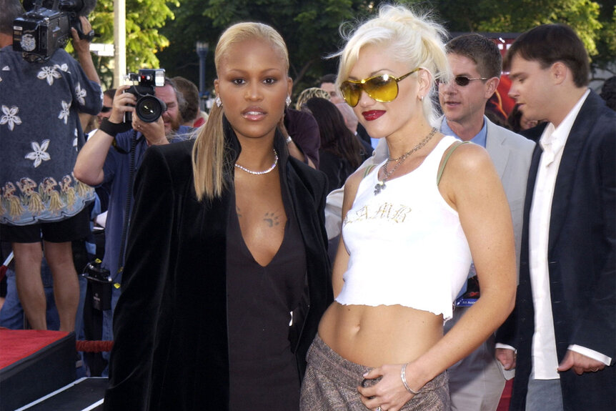 Gwen Stefani and Eve pose on a red carpet circo 2001