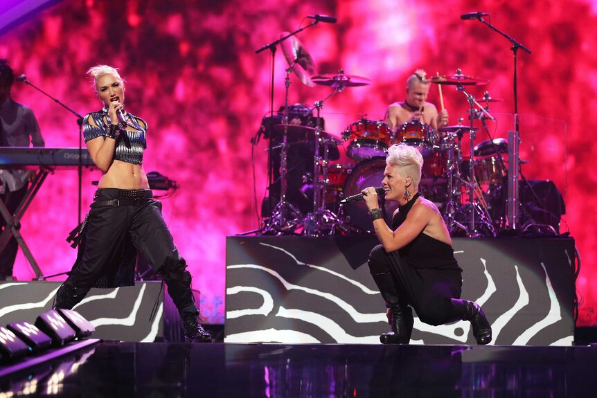 Gwen Stefani and Pink performing on stage in 2012.