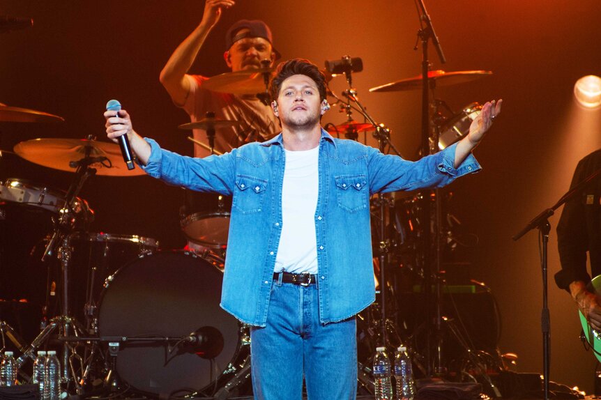 Niall Horan performing on stage.