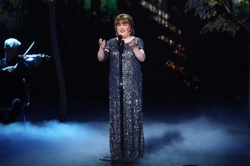 Susan Boyle performing on stage.