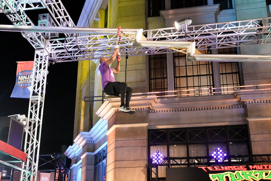 Miles Avery swings while completing the American Ninja Warrior Season 15 obstacle course
