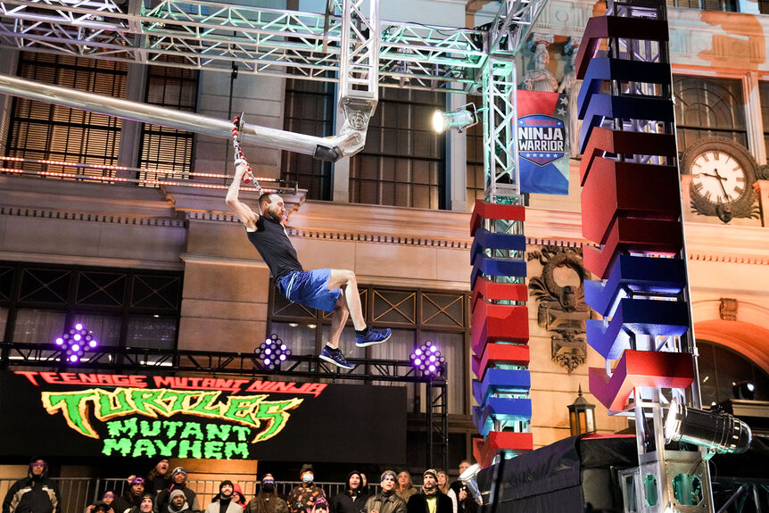 Ryan Stratis jumps while completing the American Ninja Warrior Season 15 obstacle course