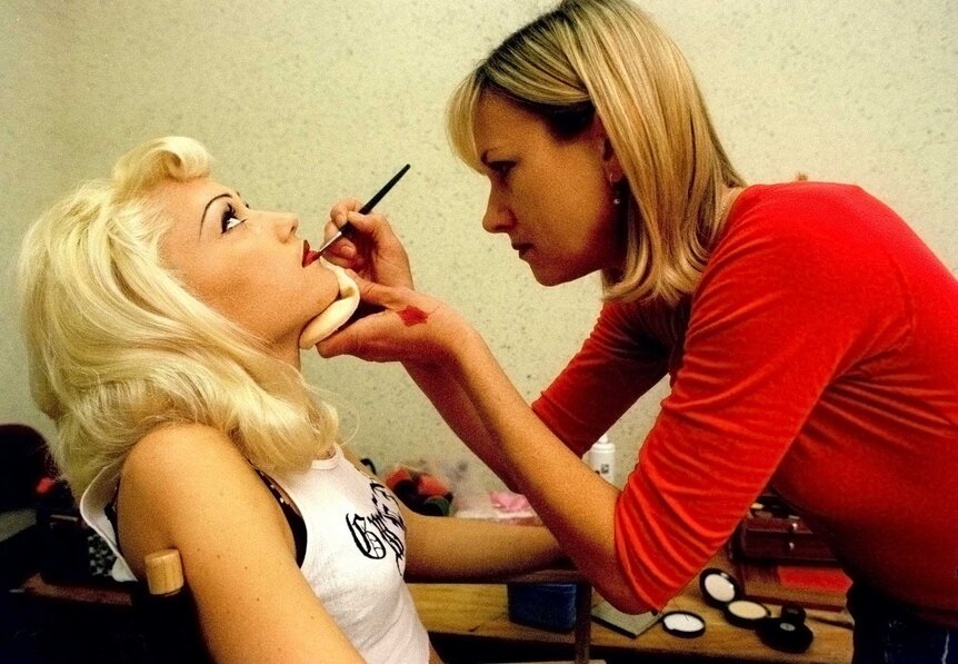 Gwen Stefani getting her makeup retouched by Nancy Von Der Launitz.