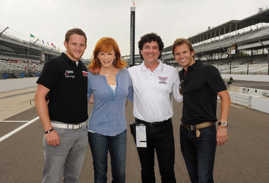 Shelby Blackstock, Reba McEntire, Dan Wheldon, and Scott Borchetta at the Brickyard 400.