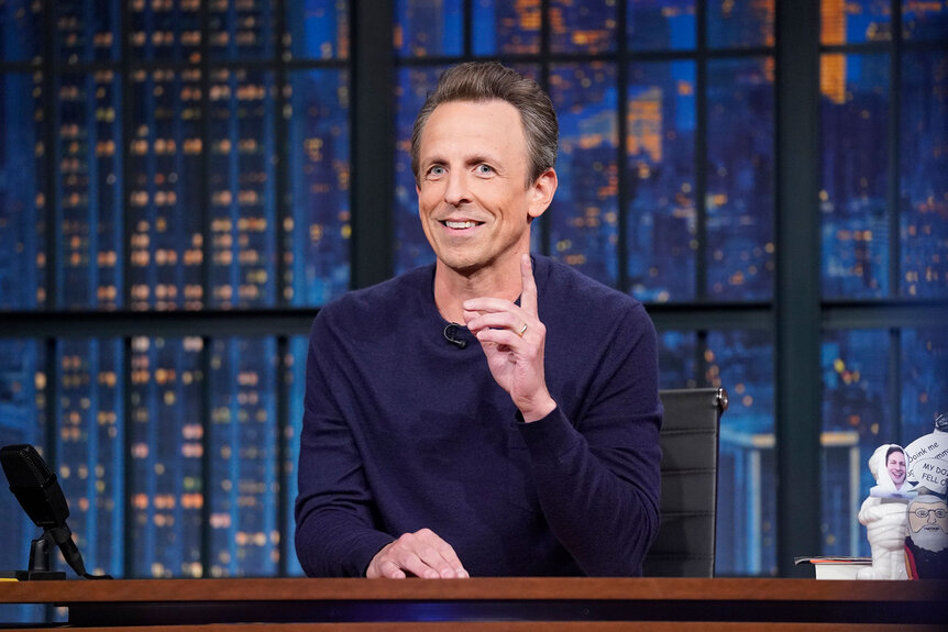 Seth Meyers sits behind his desk while hosting 'Late Night with Seth Meyers'
