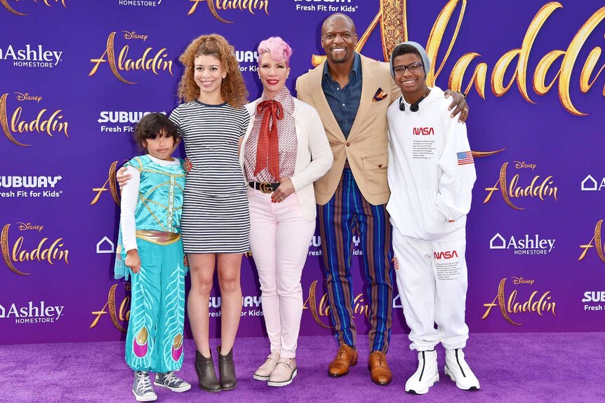 Terry Crews and his family appear at the Aladdin premiere.