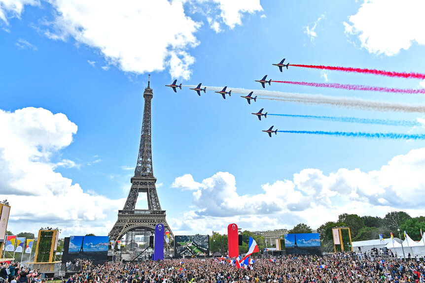 French Elite acrobatic team Patrouille de France flies over the Eiffel Tower.