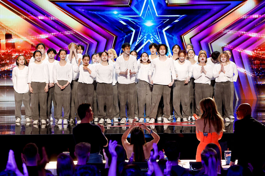 Chibi Unity standing on the America's Got Talent stage